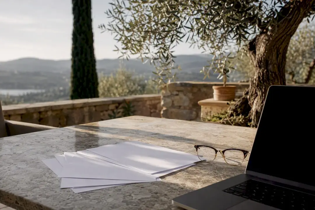 Blank documents and laptop for visa application
