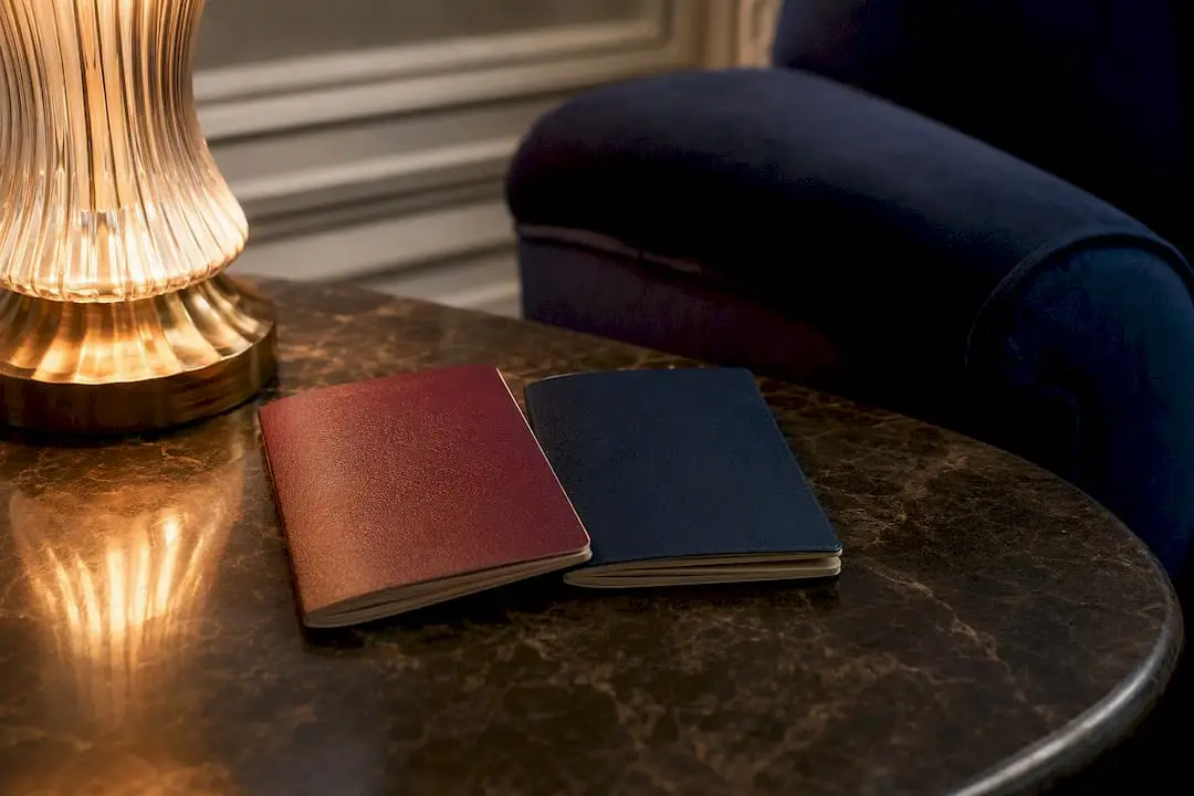 Italian and U.S. passports side-by-side on table