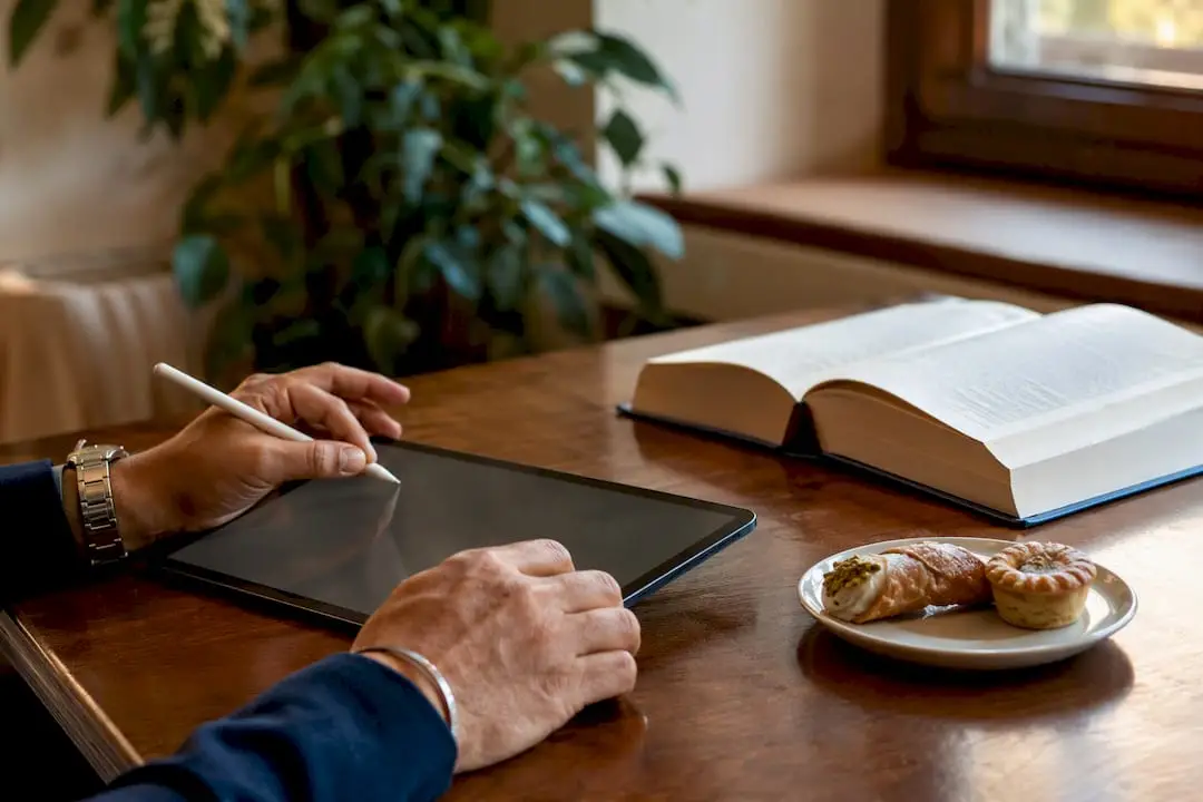 Hands entering family data on tablet