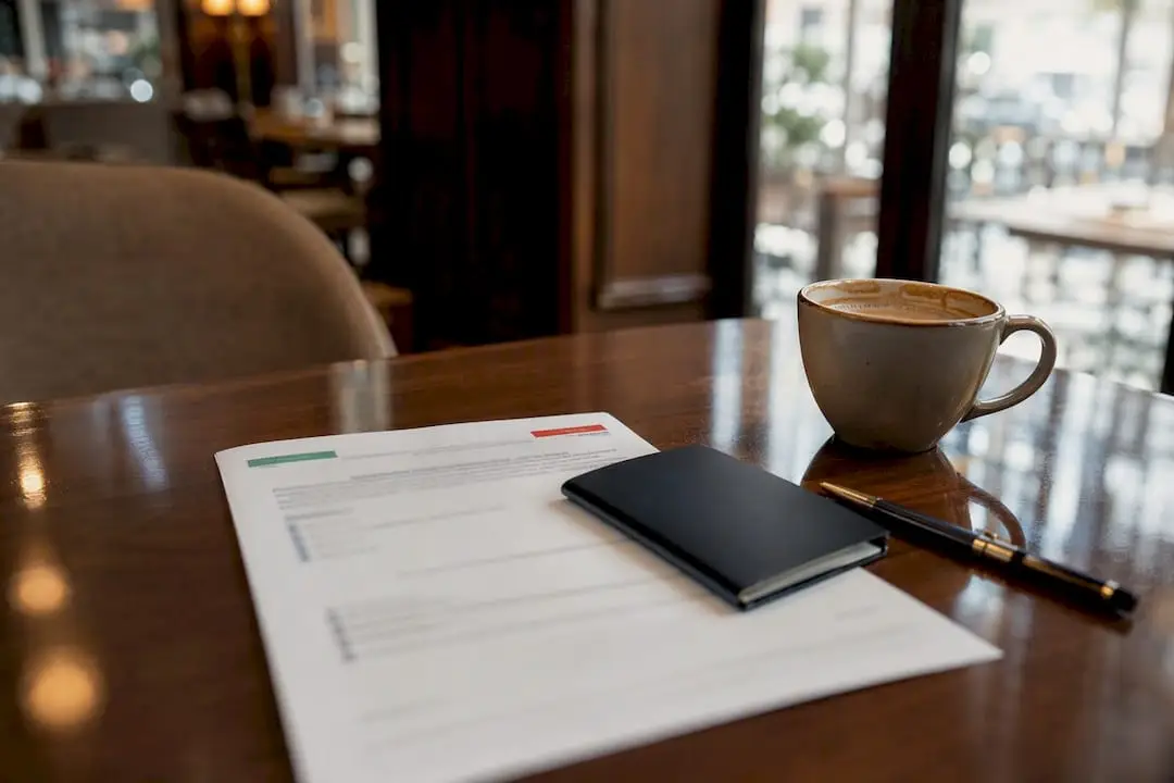 Health insurance certificate and passport on table