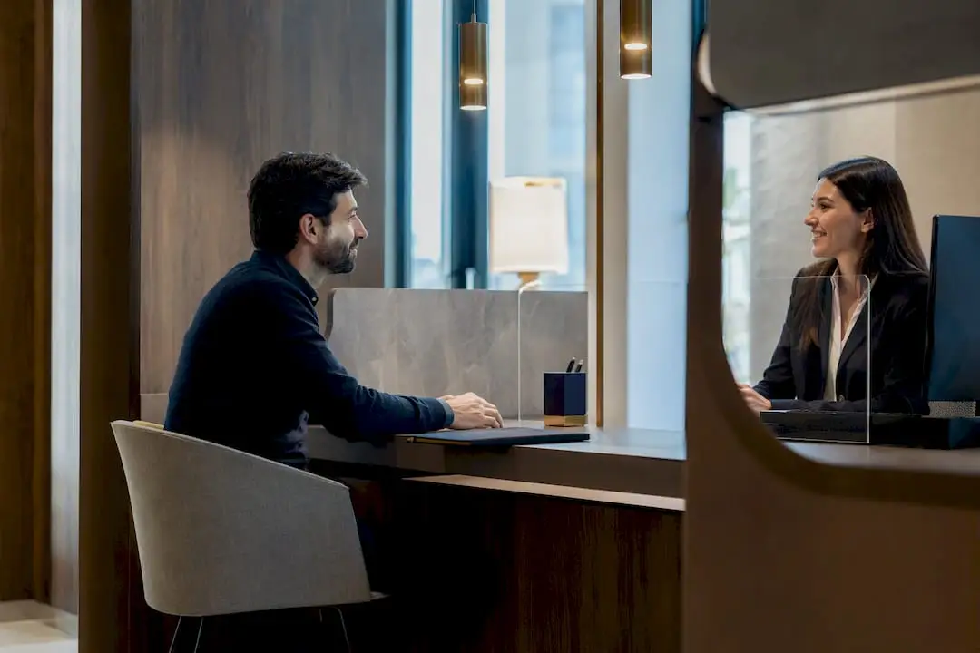 Expat at Italian bank service counter